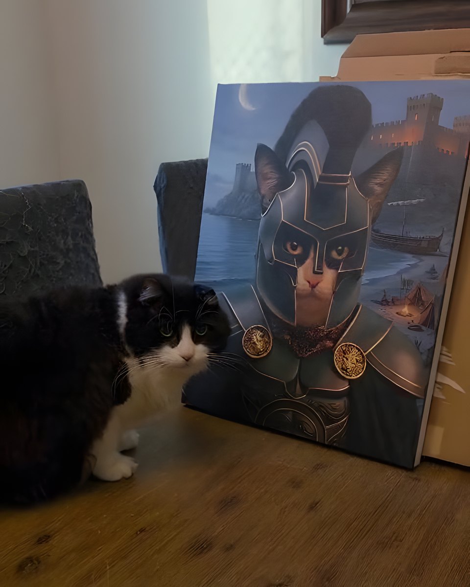 A cat sitting beside its own portrait